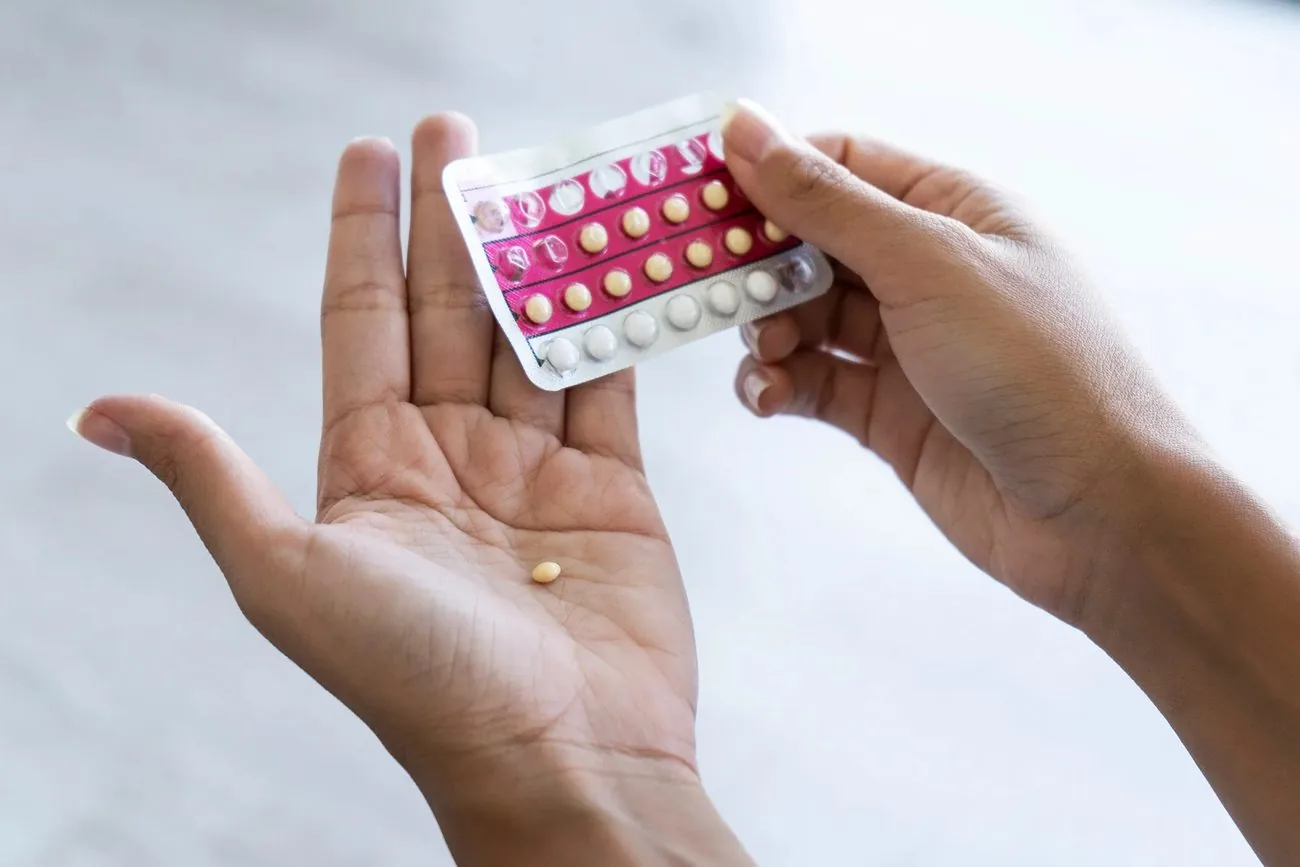 A pack of contraceptive pills held in the hand